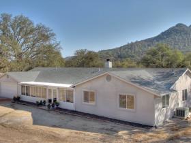 View Of Front Of Home. Solar Panels On Rear Side Of Roof.