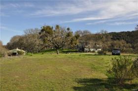 View of garage & guest house from building pad