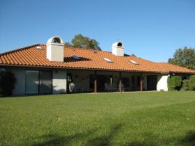 Rear Of Home With Beautiful Covered Patio